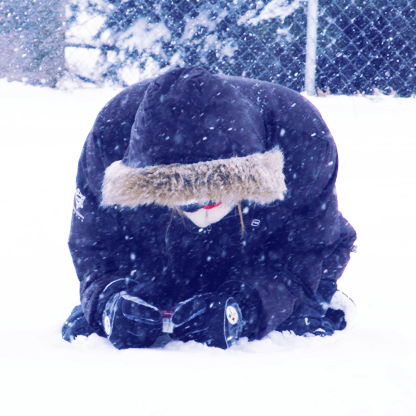 Image of the designer taking pictures in the snow