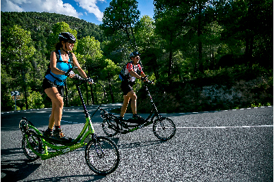 People riding ElliptiGOs
